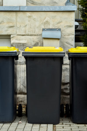 View of garbage containers in city on winter dayの写真素材