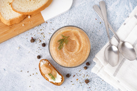 Glass with delicious caviar of capelin and crouton on gray backgroundの写真素材
