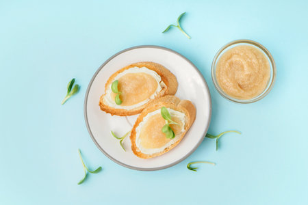 Delicious canape with caviar of capelin and microgreen on blue backgroundの写真素材