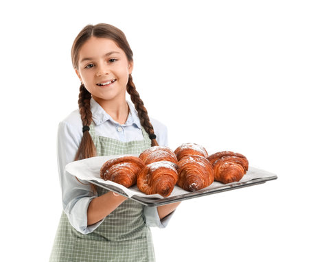 Little baker with tray of tasty croissants on white backgroundの写真素材