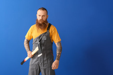 Handsome lumberjack on color backgroundの写真素材