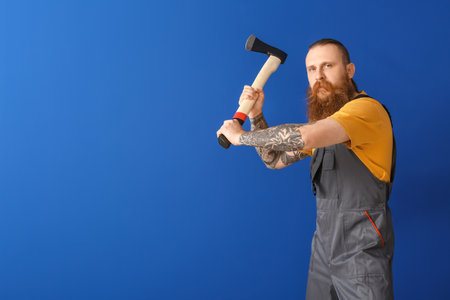 Handsome lumberjack on color backgroundの写真素材