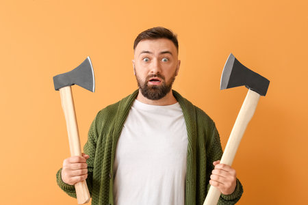 Handsome lumberjack on color backgroundの写真素材