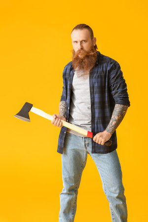 Handsome lumberjack on color backgroundの写真素材