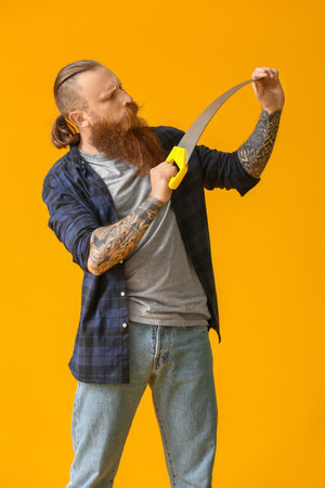 Handsome lumberjack on color backgroundの写真素材