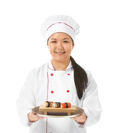 Beautiful Asian chef with sushi rolls on white backgroundの写真素材