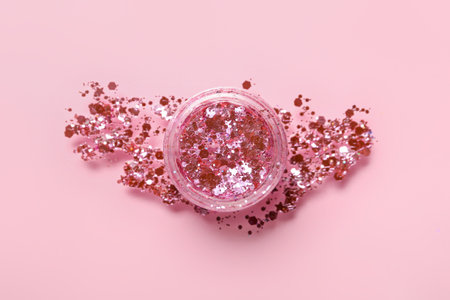 Jar of glitter with stroke on pink backgroundの写真素材