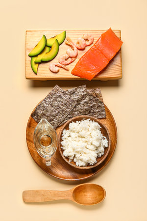 Composition with ingredients for preparing tasty sushi rolls on color backgroundの写真素材