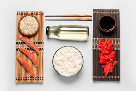 Composition with different ingredients for preparing tasty sushi rolls on white backgroundの写真素材