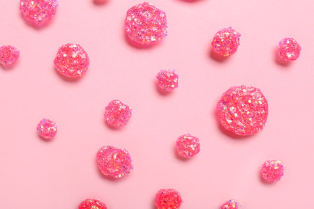 Glitter samples on pink backgroundの写真素材