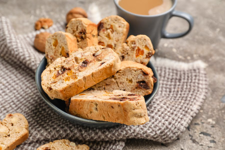 Bowl of tasty biscotti cookies on grunge background, closeupの写真素材