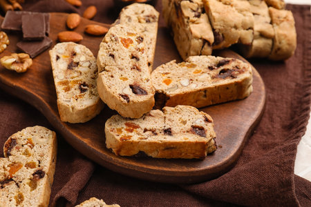 Wooden board with tasty biscotti cookies on table, closeupの写真素材