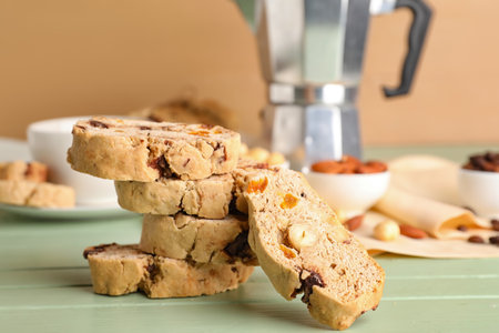 Stack of tasty biscotti cookies on color wooden tableの写真素材
