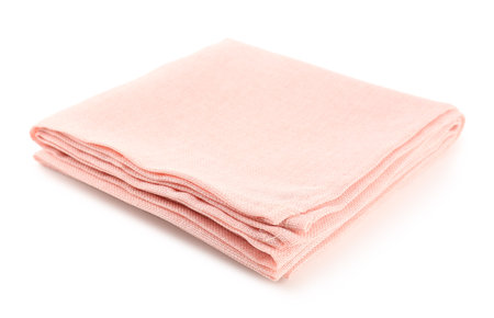 Folded pink napkin on white backgroundの写真素材