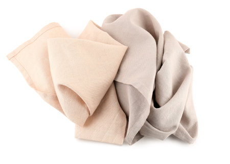 Crumpled fabric napkins on white backgroundの写真素材