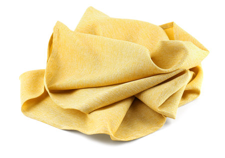 Yellow fabric napkin on white backgroundの写真素材