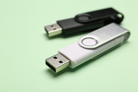 USB flash drives on green backgroundの写真素材