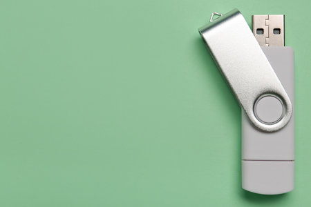USB flash drive on green backgroundの写真素材