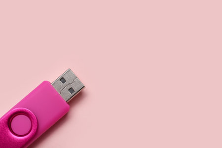 USB flash drive on pink backgroundの写真素材