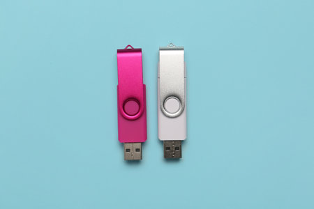 USB flash drives on color backgroundの写真素材