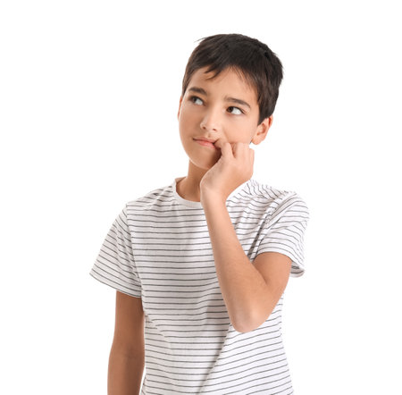 Little boy biting nails on white backgroundの写真素材