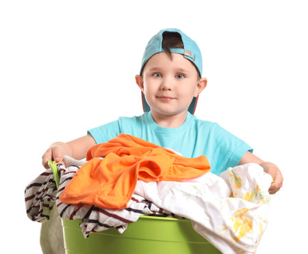 Little boy with laundry on white backgroundの写真素材