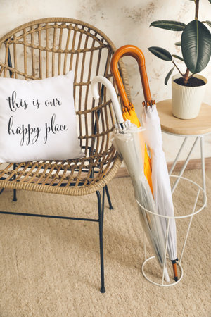 Umbrellas and armchair in the interior of the hallの写真素材