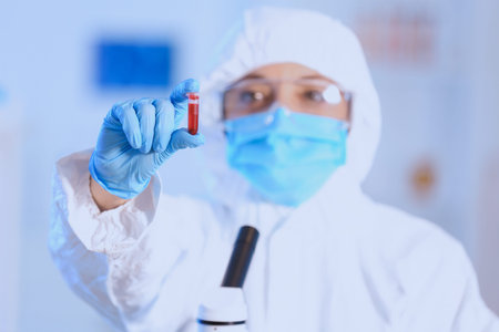 Scientist working with test tube in laboratory