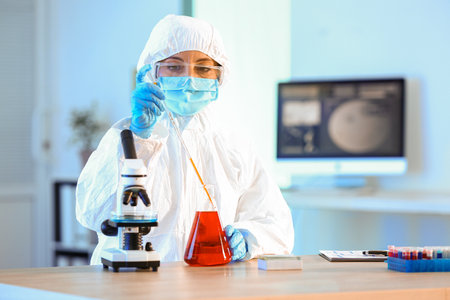 Scientist working with sample in laboratoryの写真素材