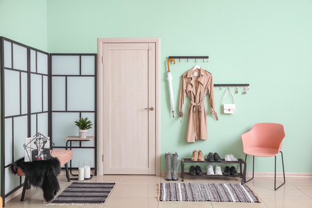 Stylish interior of modern hall with shoes on standの写真素材