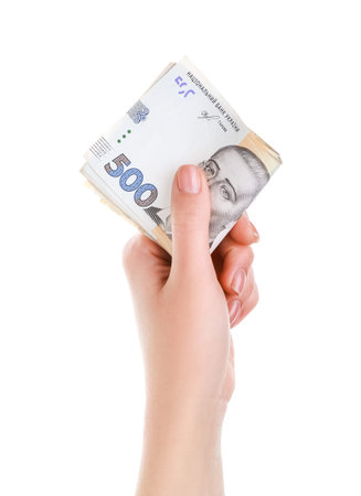 Woman with hryvnia banknotes on white background