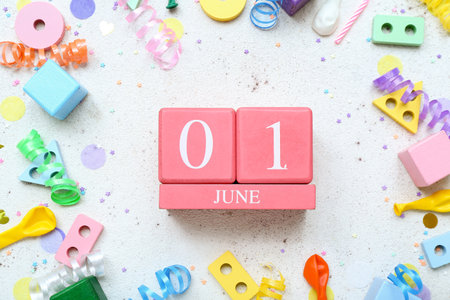 Calendar with date of Children's Day, toys and confetti on white backgroundの写真素材