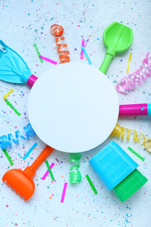 Blank card with baby toys and confetti on grunge background. Children's Day celebrationの写真素材