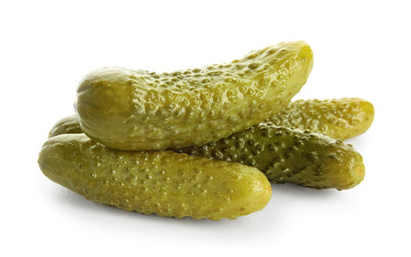 Tasty fermented cucumbers on white backgroundの写真素材