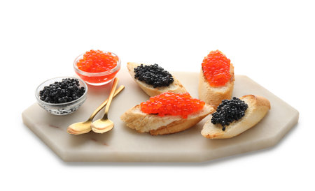 Tasty bruschettas with red and black caviar on white backgroundの写真素材