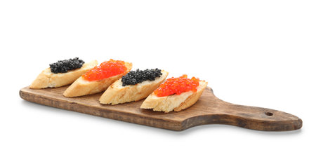 Tasty bruschettas with red and black caviar on white backgroundの写真素材
