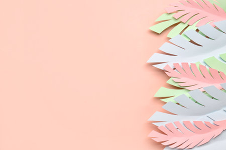 Paper tropical leaves on pink backgroundの写真素材