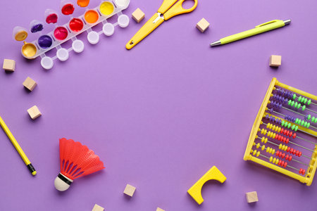 Frame made of toys and school stationery on purple background. Children's Day celebrationの写真素材