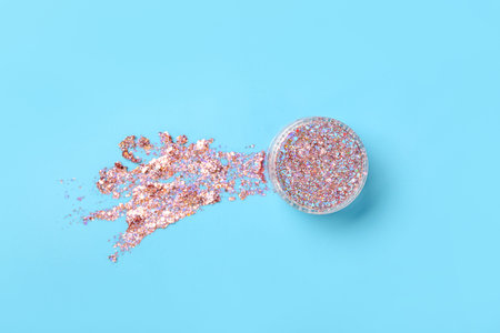 Jar of glitter with stroke on blue background