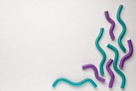 hair curlers on light background