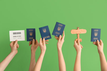 Women with Ukrainian passports, wooden airplane and negative covid-19 test result on green...