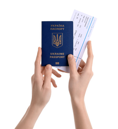Woman with Ukrainian passport and ticket on white backgroundの写真素材