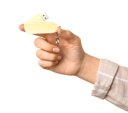 Woman holding wooden USB flash drive isolated on white backgroundの写真素材