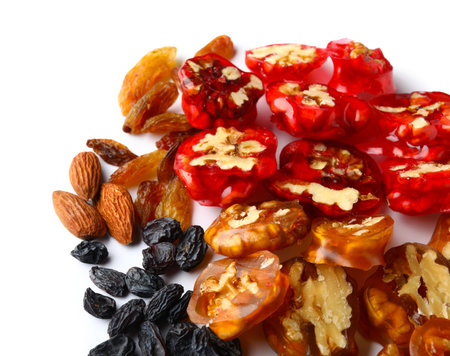Delicious churchkhela, walnuts, almonds and raisins isolated on white backgroundの写真素材