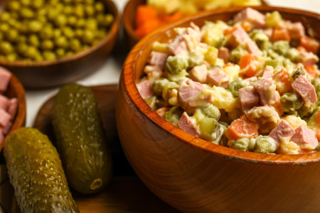 Bowl of tasty Olivier salad on table, closeupの写真素材