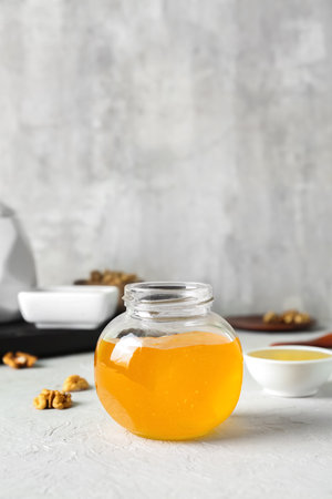 Jar of sweet honey on tableの写真素材