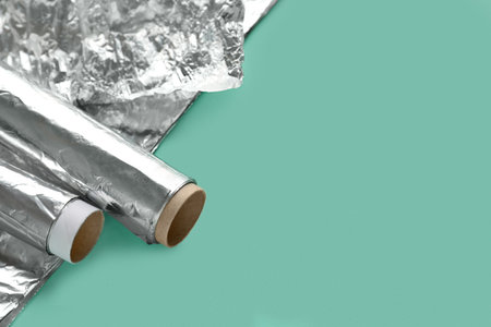 Rolls of aluminum foil on color backgroundの写真素材