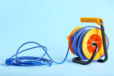 Extension electric cable reel on color backgroundの写真素材