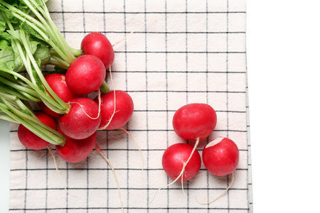 Bunch of fresh radish with green leaves on white backgroundの写真素材