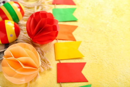 Mexican maracas with paper decor and flags on yellow background, closeupの写真素材